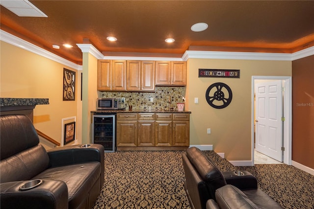 interior space featuring ornamental molding, beverage cooler, and decorative backsplash