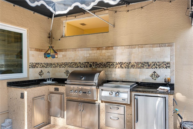 view of patio / terrace with sink, a grill, and exterior kitchen