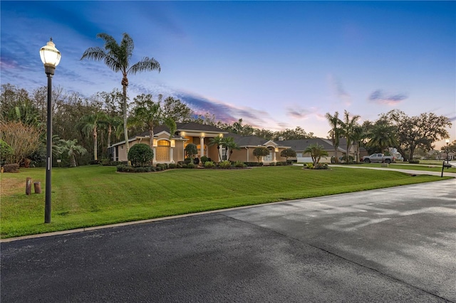 view of front of property with a lawn