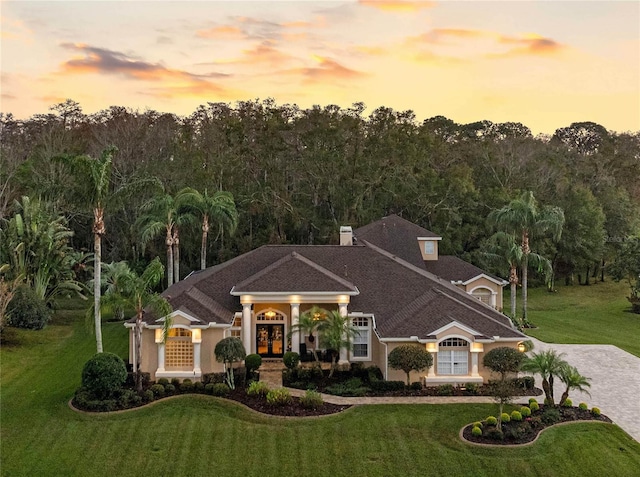 view of front of house with a lawn