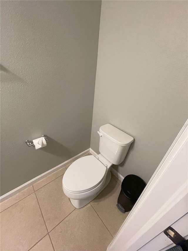 bathroom featuring tile patterned floors and toilet