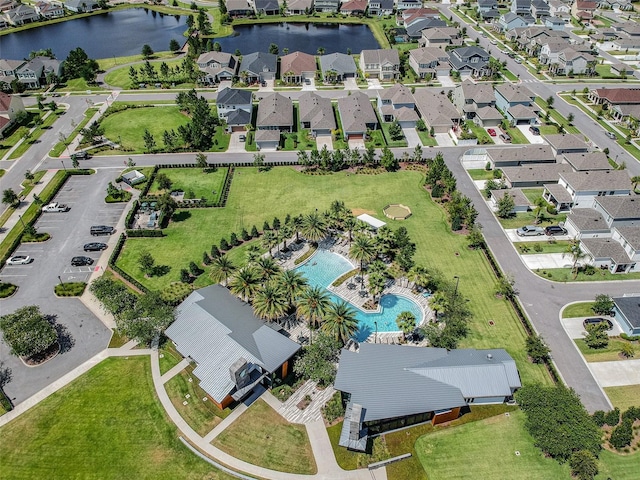 birds eye view of property with a water view