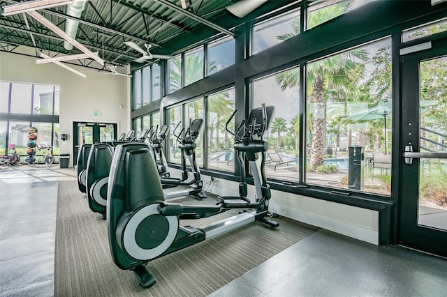 workout area featuring a high ceiling