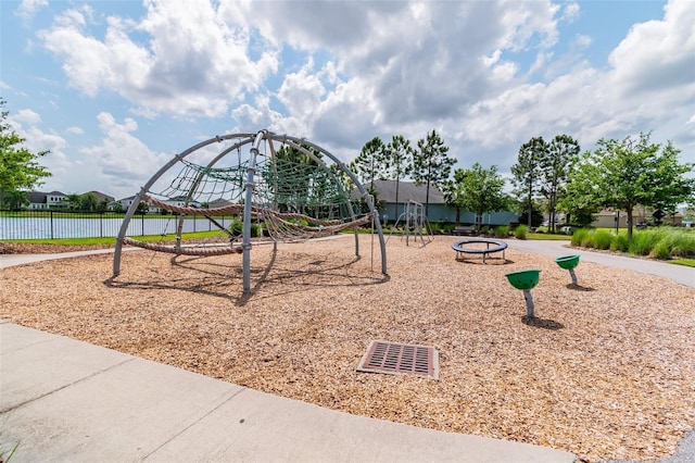 view of jungle gym with a water view