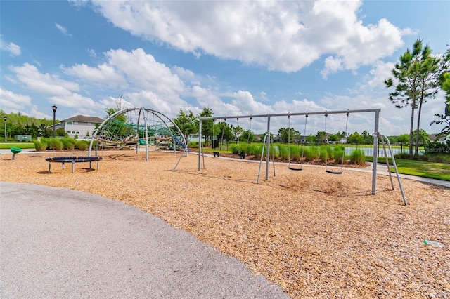 view of playground with a water view