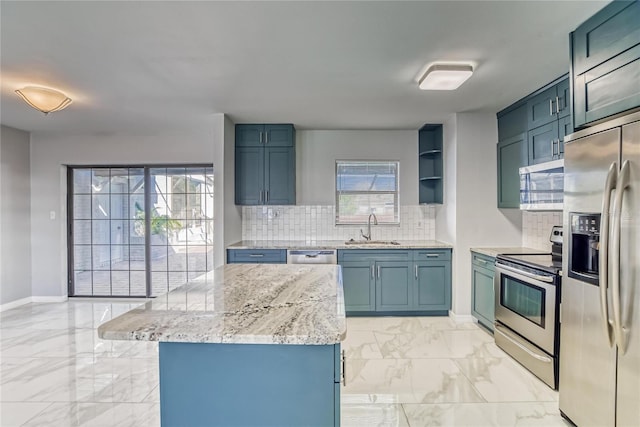 kitchen featuring tasteful backsplash, light stone countertops, sink, and stainless steel appliances