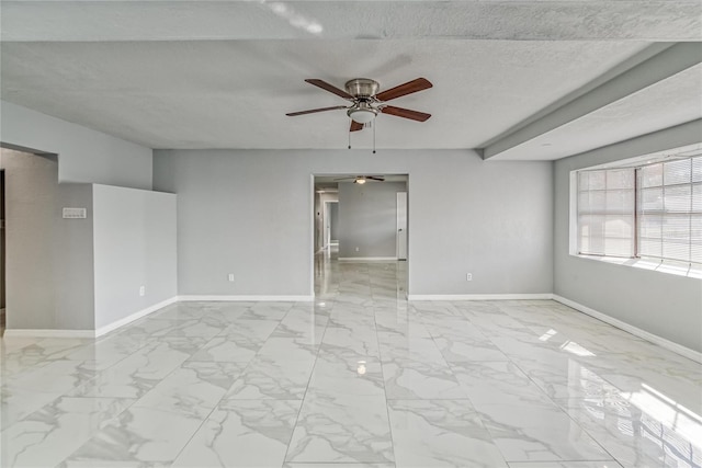 unfurnished room featuring a textured ceiling and ceiling fan