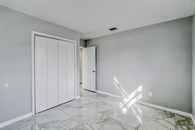 unfurnished bedroom featuring a closet