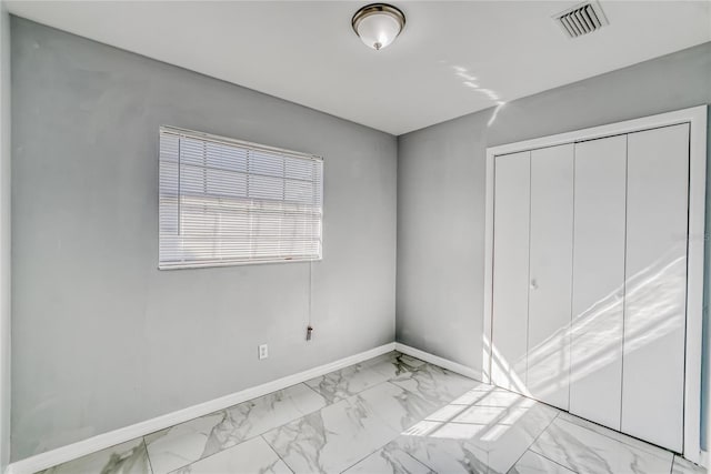 unfurnished bedroom featuring a closet