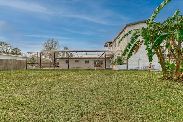 view of yard featuring glass enclosure