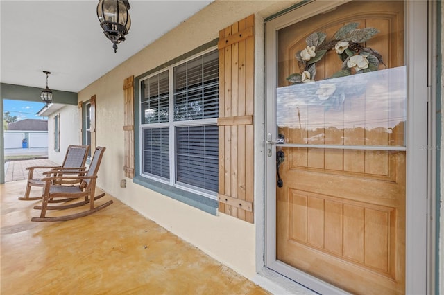 doorway to property featuring covered porch