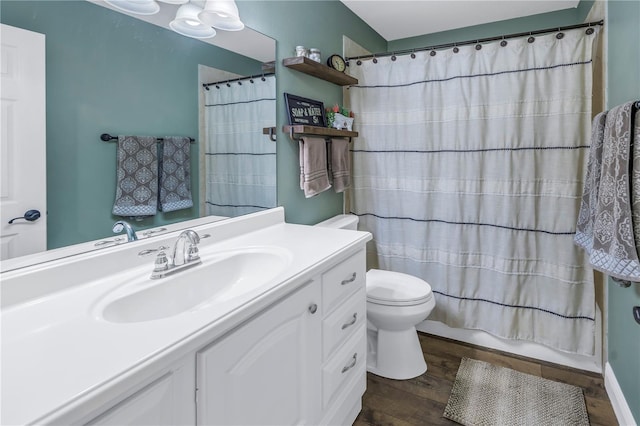 full bathroom featuring toilet, vanity, wood-type flooring, and shower / bath combination with curtain