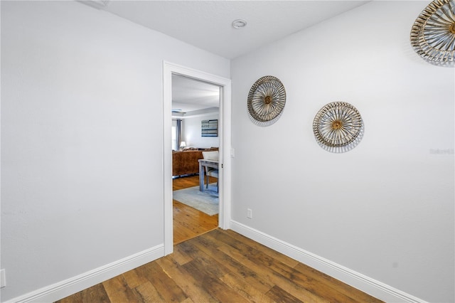 hallway with dark wood-type flooring