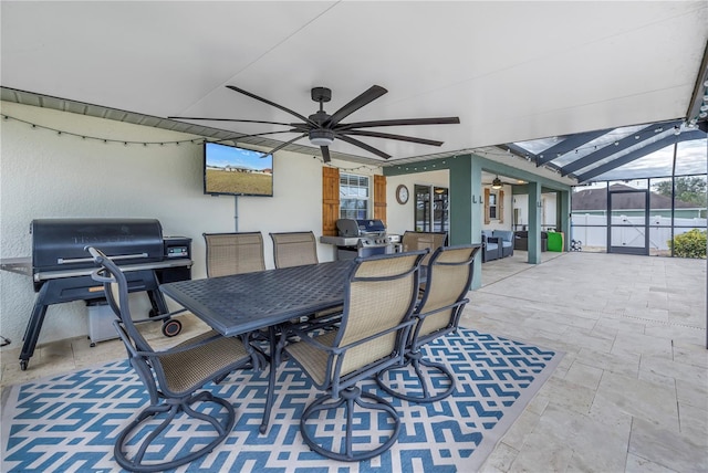 view of patio with ceiling fan and grilling area