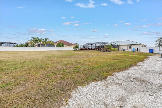 view of yard with a lanai