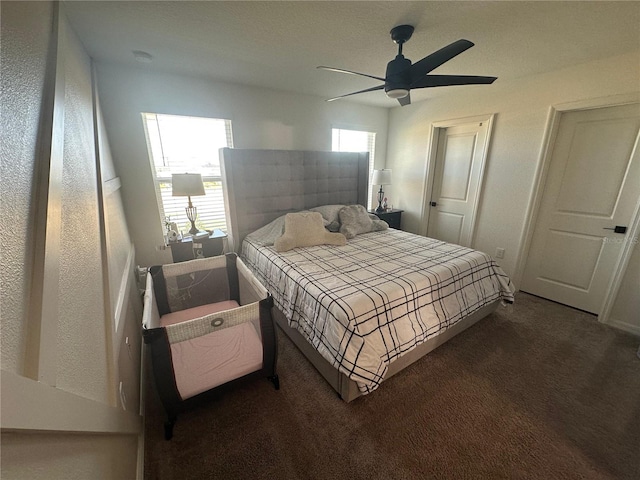 carpeted bedroom featuring ceiling fan