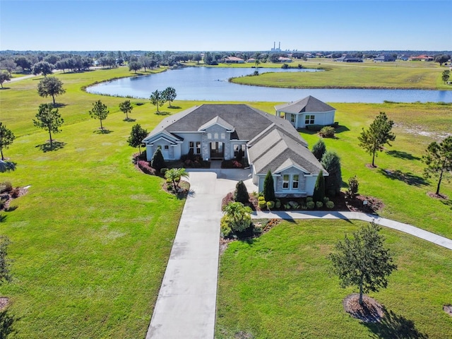 birds eye view of property with a water view