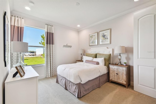 carpeted bedroom featuring crown molding