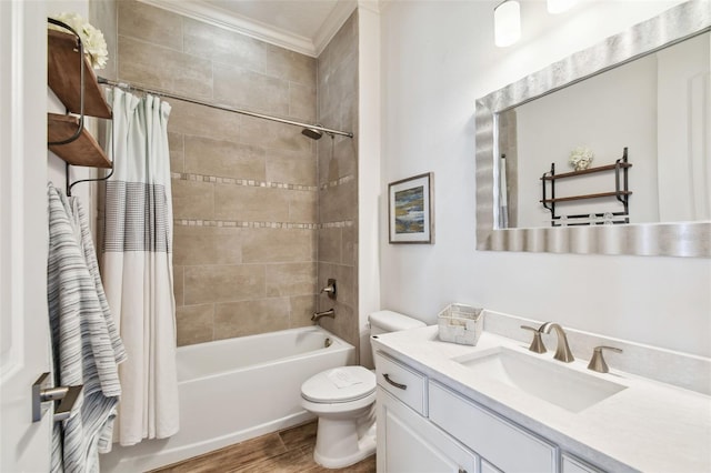 full bathroom with shower / bath combo, hardwood / wood-style floors, toilet, vanity, and ornamental molding