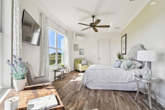 bedroom with hardwood / wood-style floors, ceiling fan, ornamental molding, and a wall unit AC