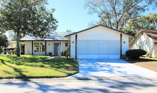 single story home featuring a garage and a front lawn