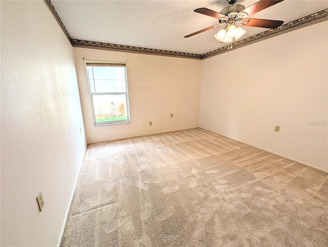 unfurnished room featuring light carpet and ceiling fan