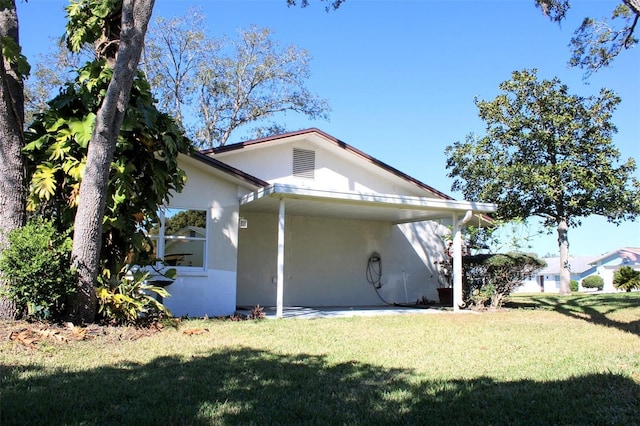 view of home's exterior with a lawn