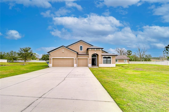 view of front of house featuring a front yard and a garage