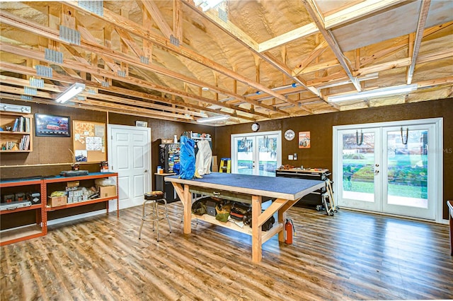 rec room featuring wood finished floors, plenty of natural light, and french doors