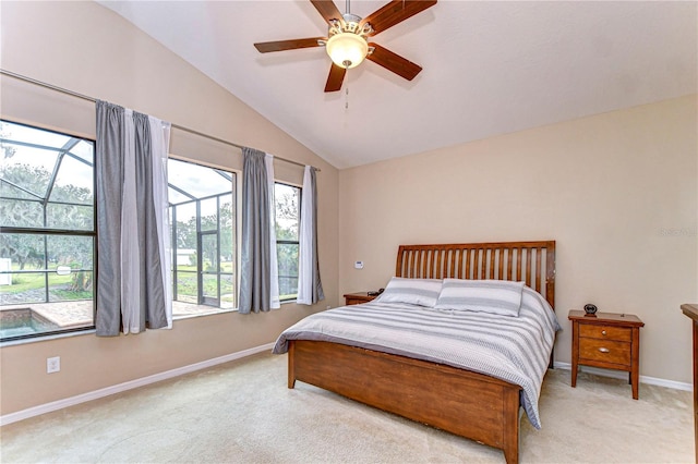 bedroom featuring light colored carpet, baseboards, multiple windows, and lofted ceiling