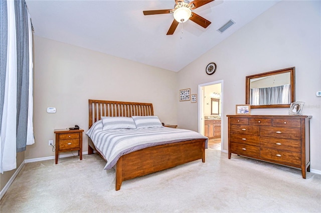 bedroom with baseboards, ensuite bathroom, visible vents, high vaulted ceiling, and light colored carpet
