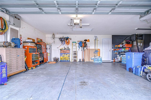 garage with a garage door opener and water heater