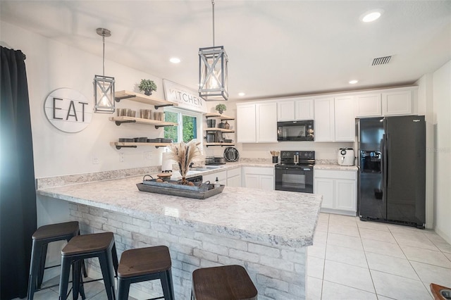 kitchen featuring kitchen peninsula, white cabinetry, hanging light fixtures, and black appliances