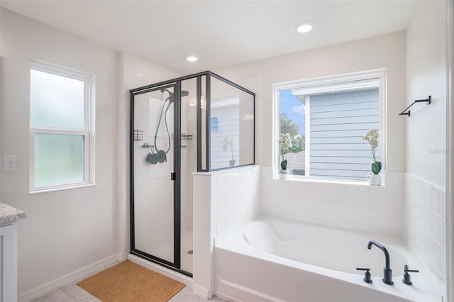 bathroom with plus walk in shower and tile patterned floors