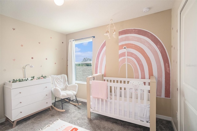 bedroom with carpet flooring and a nursery area