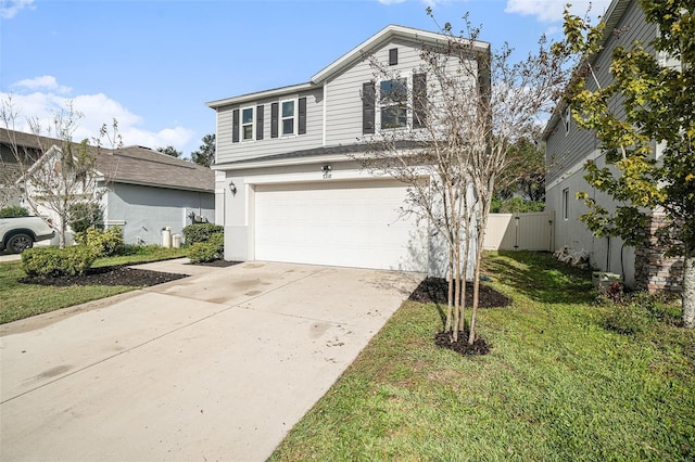 view of front property featuring a front yard and a garage