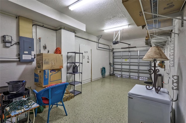 garage featuring electric panel and a garage door opener