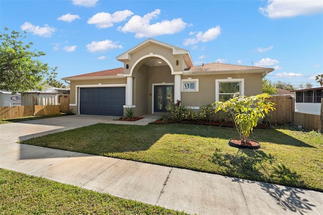 view of front facade with a front yard and a garage