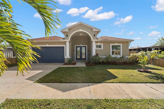 view of front of home with a garage and a front yard