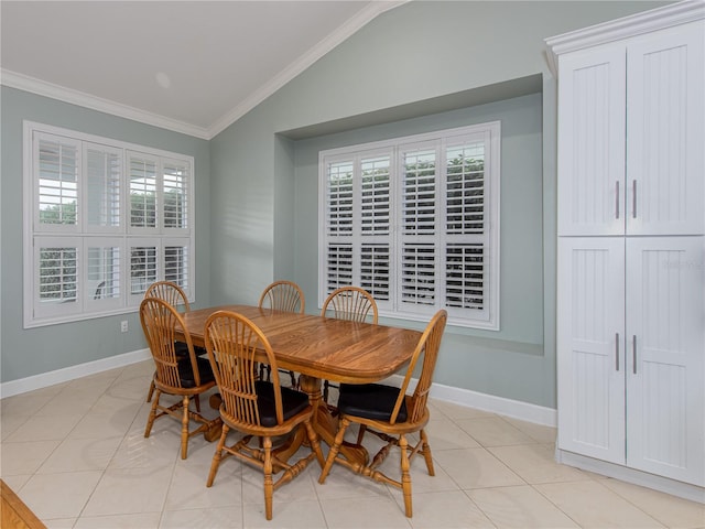 tiled dining area with vaulted ceiling and crown molding