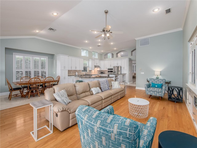4709 Corsage Dr, Lutz, FL 33558 - living room with a ceiling fan, ornamental molding, light wood-type flooring, lofted ceiling, and recessed lighting