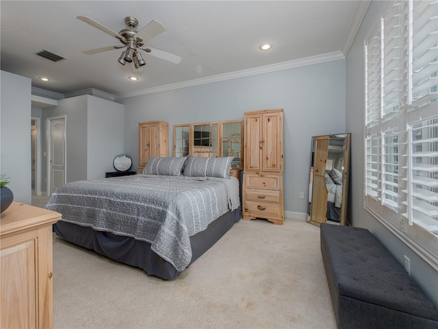 carpeted bedroom with ceiling fan and crown molding