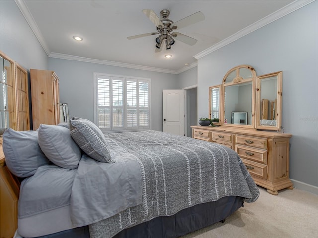 bedroom with ceiling fan, crown molding, and light colored carpet