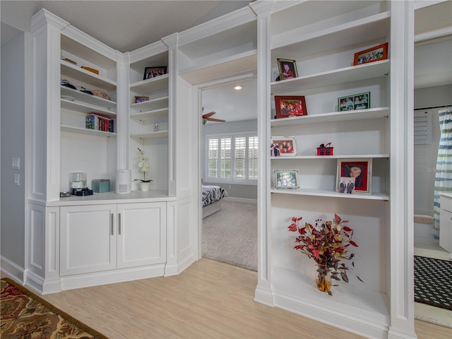 interior space featuring ceiling fan and light hardwood / wood-style flooring