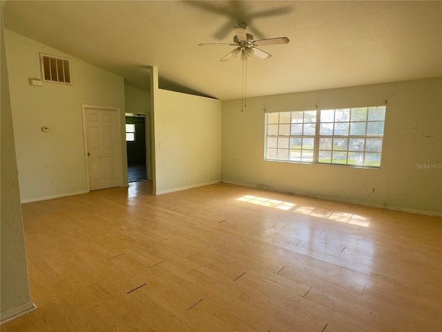 unfurnished room with light hardwood / wood-style floors, vaulted ceiling, and ceiling fan