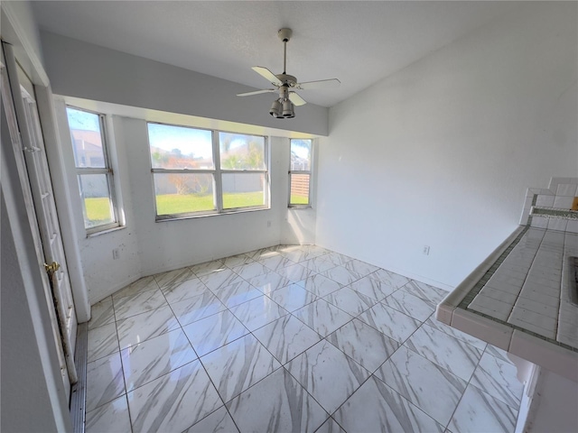 spare room featuring ceiling fan