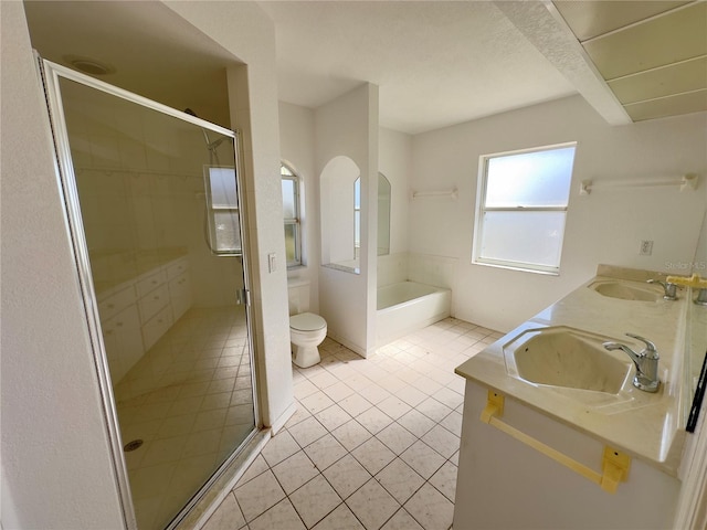 full bathroom featuring tile patterned flooring, vanity, separate shower and tub, and toilet