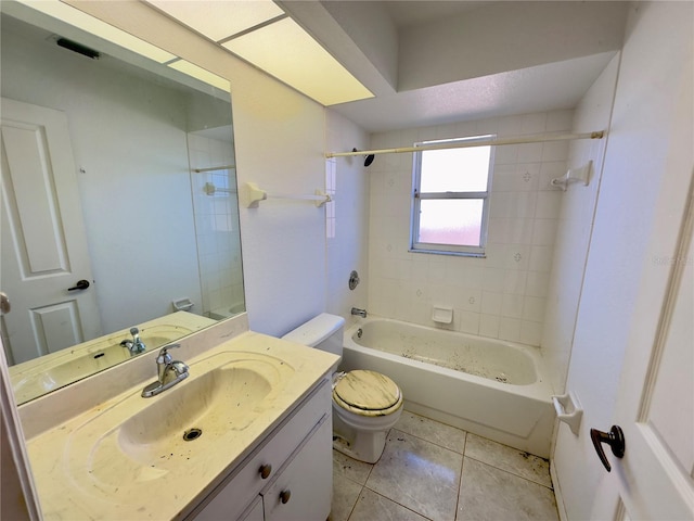 full bathroom with tile patterned floors, vanity, toilet, and tiled shower / bath