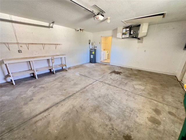 garage featuring washer and dryer and a garage door opener