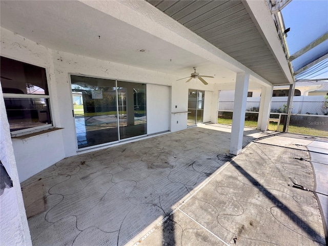 view of patio featuring ceiling fan